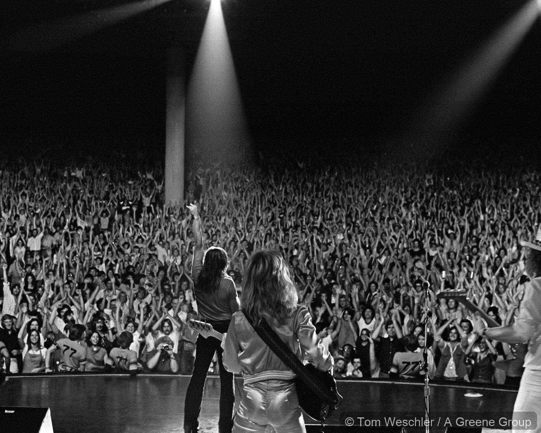 Bob Seger performing at Pine Knob in 1977 with a large crowd visible from the stage